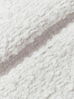 Bouclé kussenhoes Bellamie