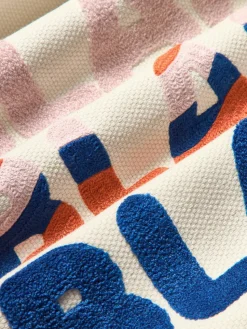 Dubbelzijdige kussenhoes Blah Blah met geborduurde opschrift