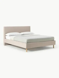 Gestoffeerd bed Giulia met houten poten