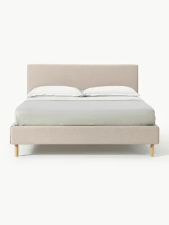 Gestoffeerd bed Giulia met houten poten