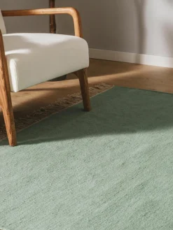 Handgeweven wollen vloerkleed Liv met franjes