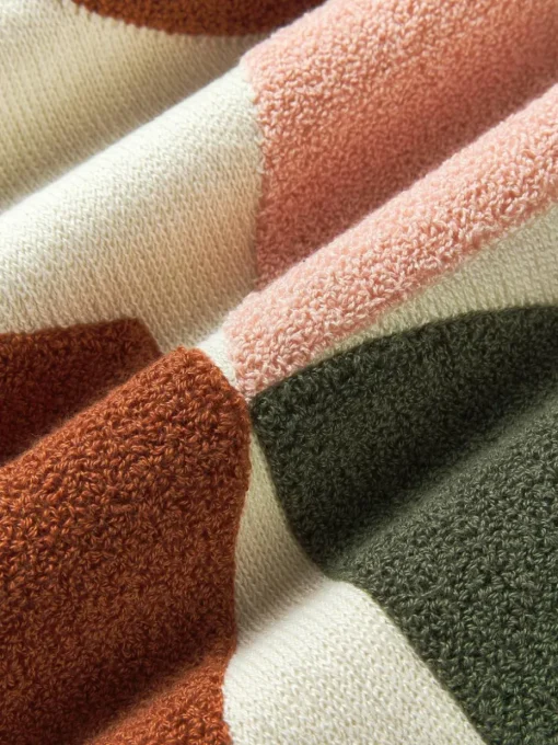 Katoenen kussenhoes Nomi met abstracte decoratie