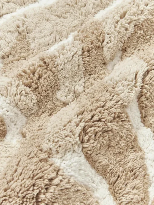 Katoenen kussenhoes Sela met getuft plantenmotief