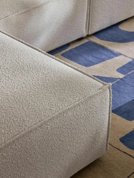 Modulaire bank Lennon (4-zits) uit bouclé met poef (links/rechts)