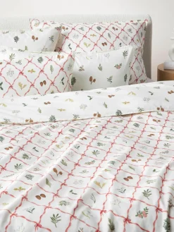 Omkeerbare katoenen perkale kussenhoes Twigs met winterse prints