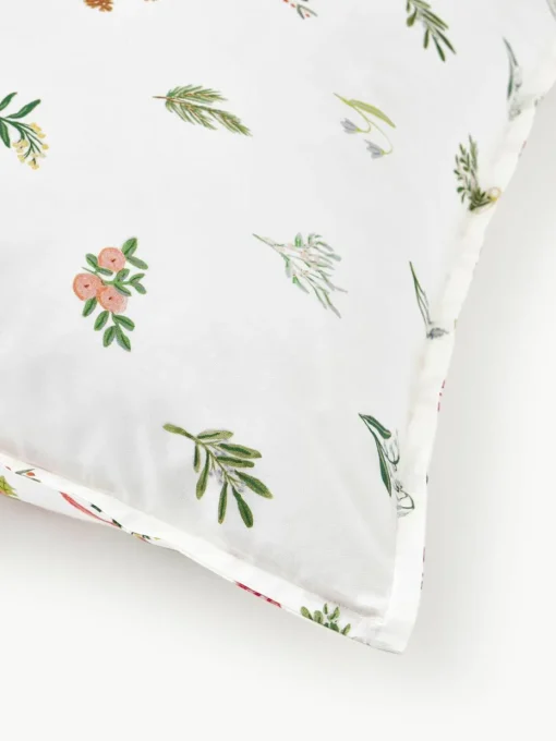 Omkeerbare katoenen perkale kussenhoes Twigs met winterse prints