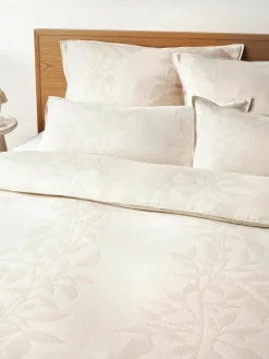 Omkeerbare mousseline kussenhoes Jasmina met bloemenpatroon in beige