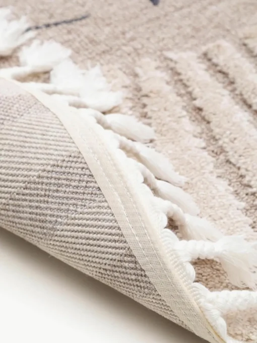 Rond kindervloerkleed Momo met kwastjes en hoog-laag effect