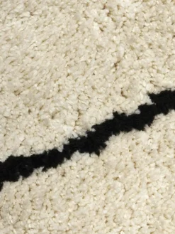 Rond pluizig hoogpolig vloerkleed Naima, handgetuft