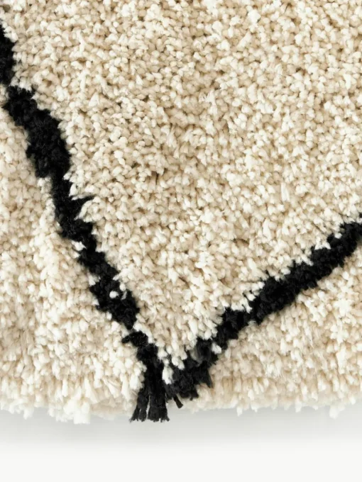 Rond pluizig hoogpolig vloerkleed Naima, handgetuft