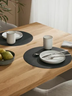 Ronde kunstleren placemats Pik, 2 stuks