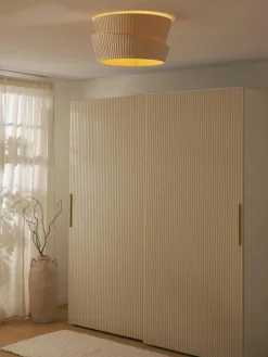 Wandlamp Nyla met asymmetrische lampenkap