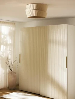 Wandlamp Nyla met asymmetrische lampenkap