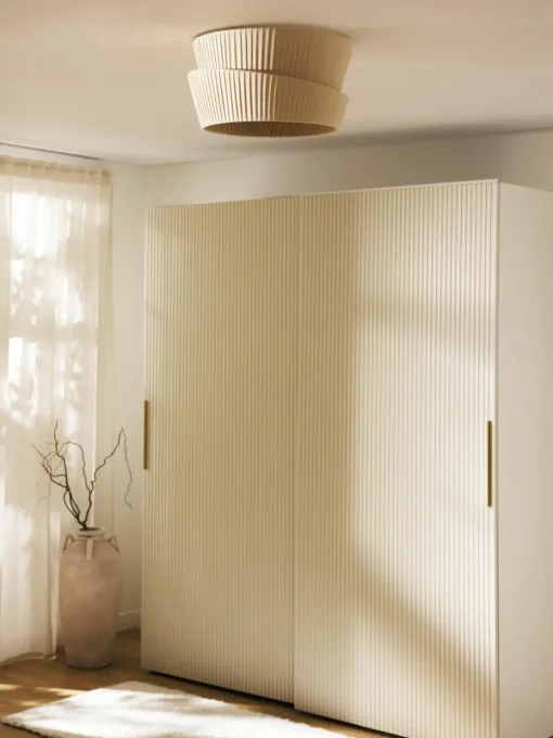 Wandlamp Nyla met asymmetrische lampenkap