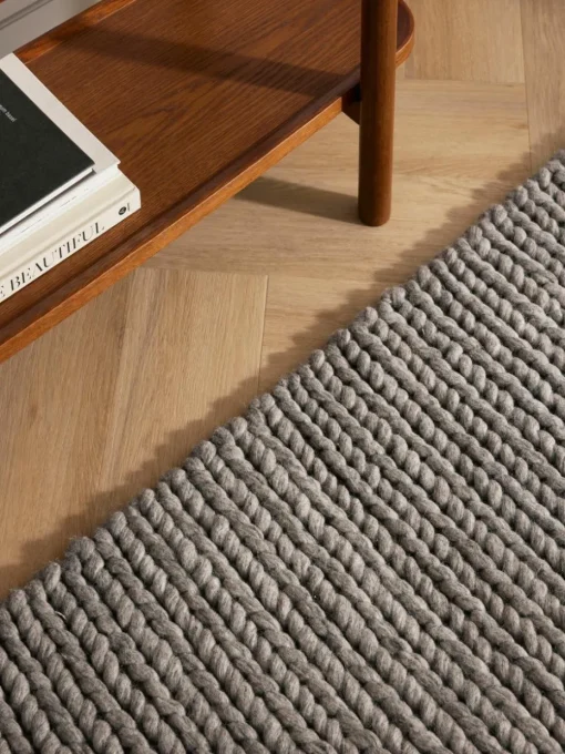 Wollen vloerkleed Bruna met gevlochten structuur