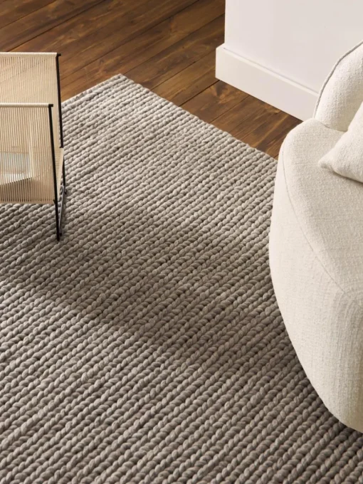 Wollen vloerkleed Bruna met gevlochten structuur